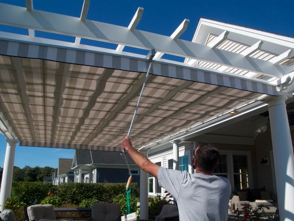 A fiberglass pergola with an overhead shade