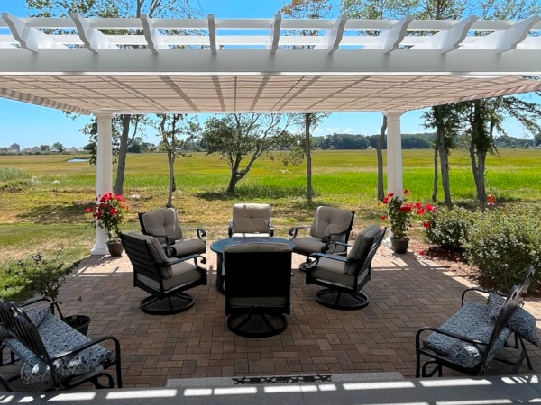 A fiberglass pergola with an overhead shade