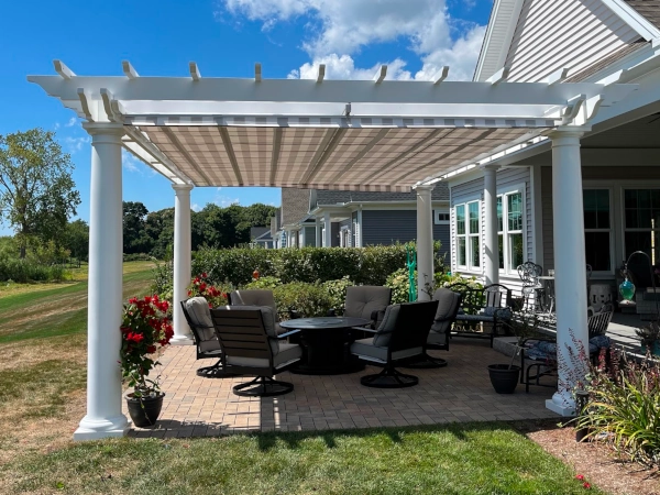 A fiberglass pergola with an overhead shade