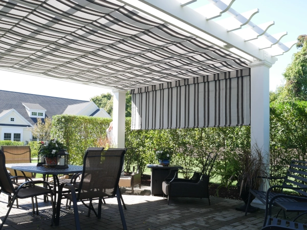 A simple fiberglass pergola beside a pool