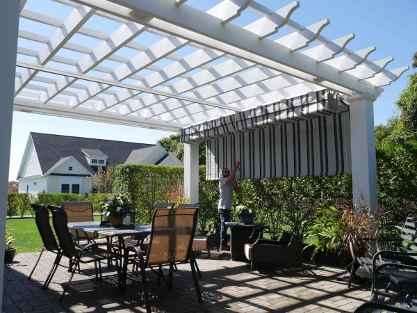 A simple fiberglass pergola beside a pool